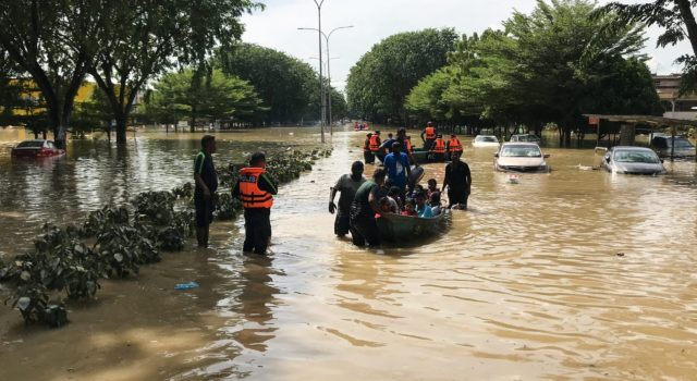 Search and rescue team evacuates flood victims in Shah Alam