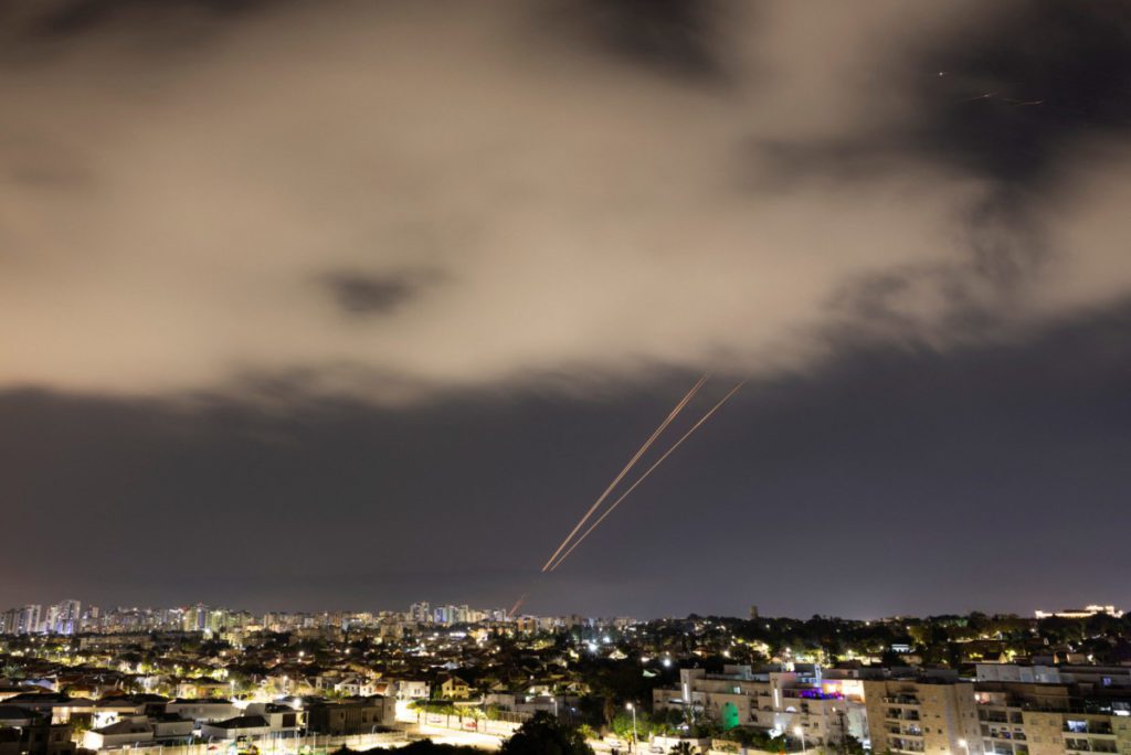Objects are intercepted in the sky after Iran launched drones and missiles towards Israel, as seen from Ashkelon
